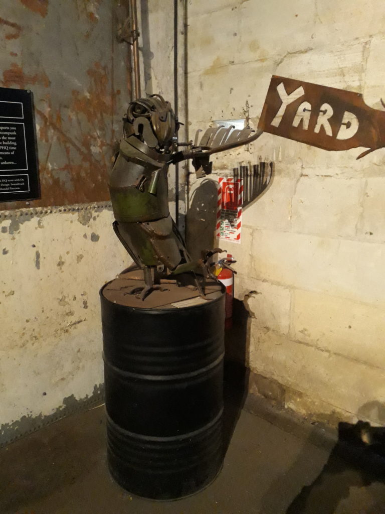 Another metall made figure standing on an oil barrel in Steampunk Headquarter Oamaru